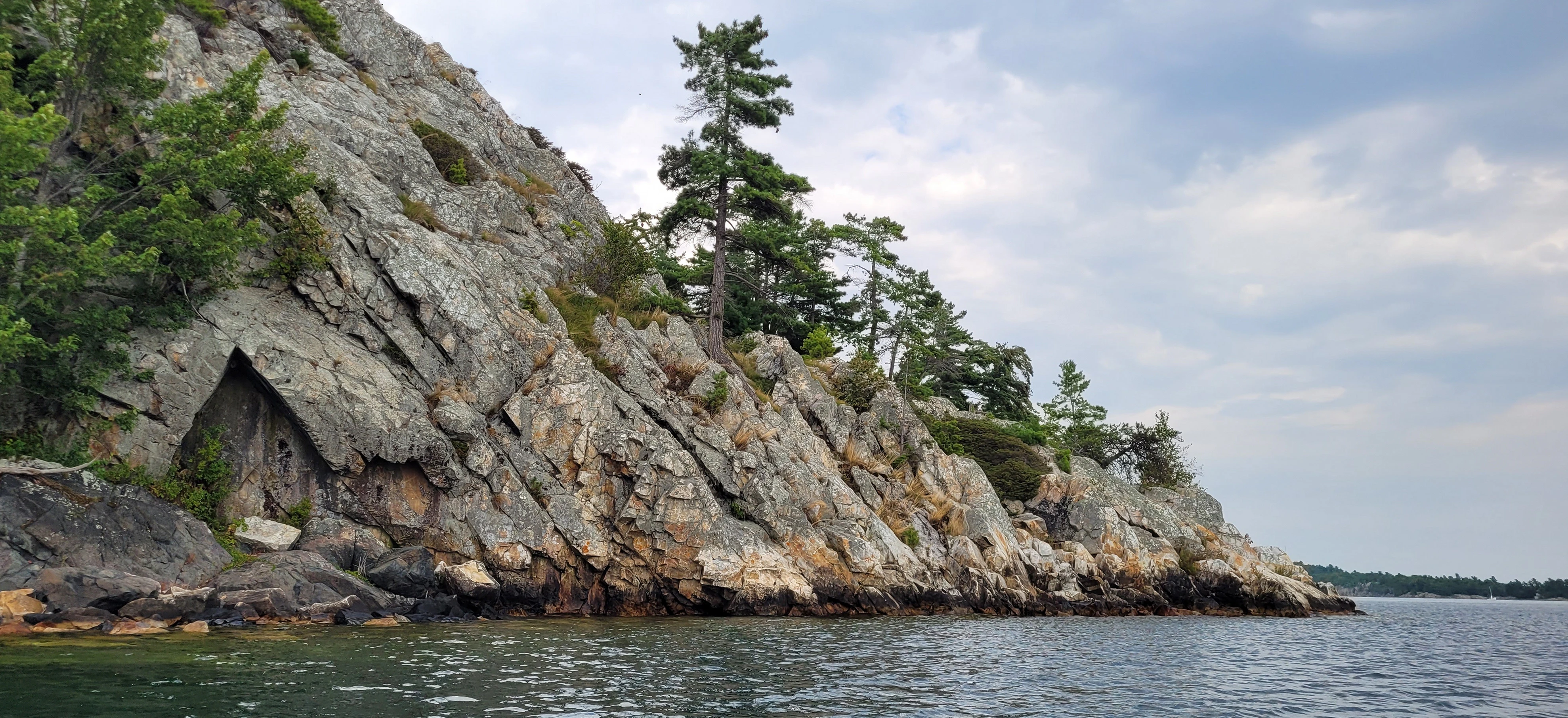 White quartzite cliffs rising above Georgian Bay in Killarney Ontario Canada